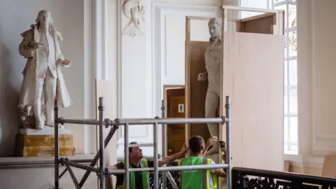 Getty Images Statue of enslaver and Waterloo war hero Sir Thomas Picton is boxed up in preparation for its removal from Cardiff City Hall on July 24, 2020 in Cardiff