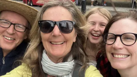 Buckle Up Dorothy Four people taking a selfie