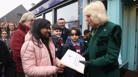 PA Media The Queen was presented with a card by pupils from Fane Street Primary School