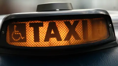 PA Media Taxi sign