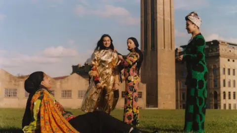 Vivek Vadoliya Women posing in Asian dress in front of Bradford mills
