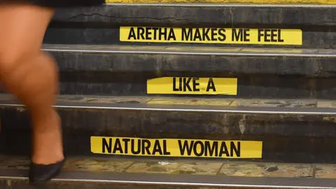 AFP The song title was pasted on a stairway at Franklin St station on the New York subway