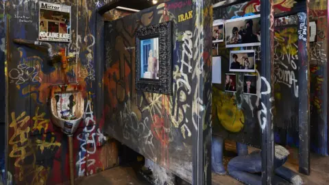 The Hole and UTA Artist Space Bathroom scene