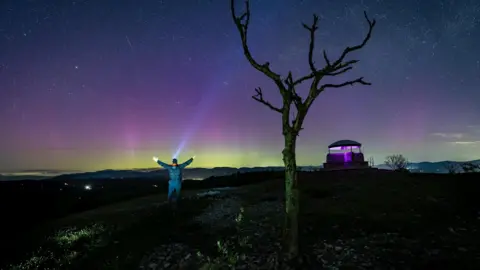 Jonny Gios A purple aurora borealis lights up the sky in Kendal 