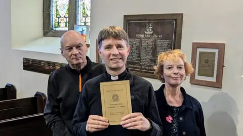 David Chadwick David Chadwick, holding an order service dating back to 1949, stands with two other people in front of a plaque newly installed on the wall of St Paul's, Ryhope 