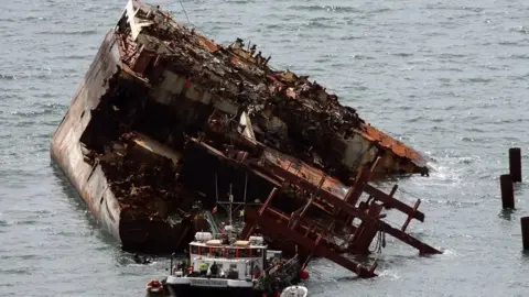 Getty Images The stricken vessel MSC Napoli grounded about a mile off Sidmouth, Devon