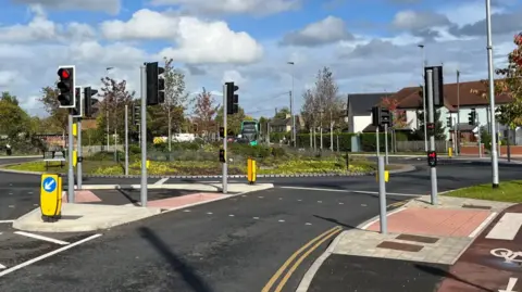 Jozef Hall/BBC The Milton Road roundabout with several traffic lights and new lanes