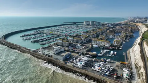 Premier Marinas A marina is seen from above on a sunny day. 