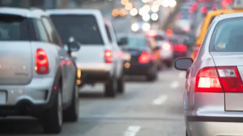 Silver Cars stuck in traffic