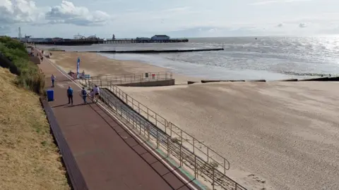 Clacton sea front with the pier in the distance.
