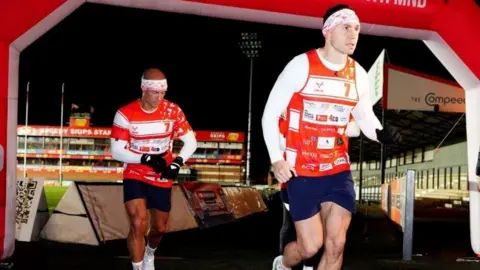 PA Media Kevin Sinfield sets off from Kingsholm Stadium, Gloucester, on day two of the Running Home for Christmas 7 in 7 Challenge, from Gloucester to Bristol, in 2024.