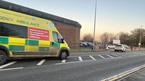 An ambulance drives down the road near Horncastle ambulance station