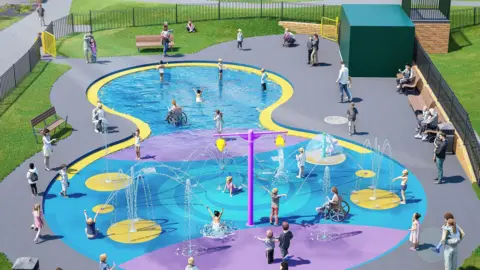 A colourful, accessible splashpad play area with fountains and shallow water is shown in a fenced park, where children play while adults sit on nearby benches.