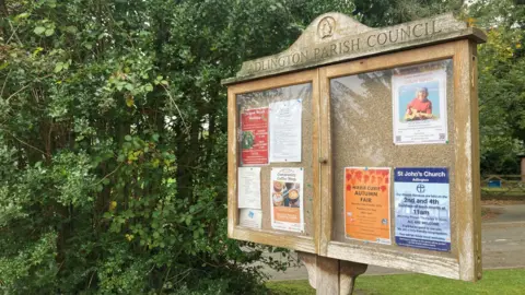 View of the Adlington Parish Council sign and noticeboard.
