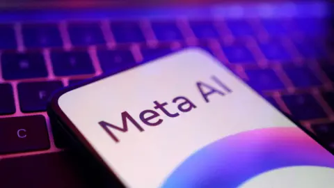 A phone showing the text "Meta AI" rests on a keyboard. The picture has pink and purple tones. 