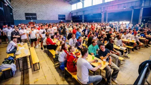 Plaster Hundreds of England fans watch a Euro 2024 match at the fan park in Prospect venue in Bristol