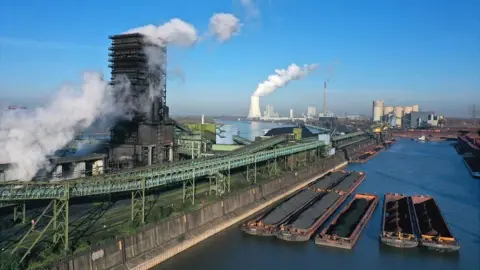 Getty Images In this aerial view barges arrive with coking coal at the Thyssenkrupp Steel Europe steelworks in Duisburg, Germany, 9 November 2021