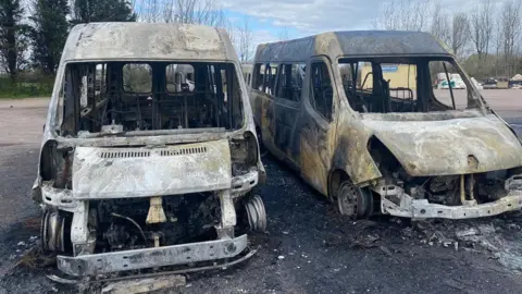 BBC Burnt-out minibuses after Bristol arson attacks