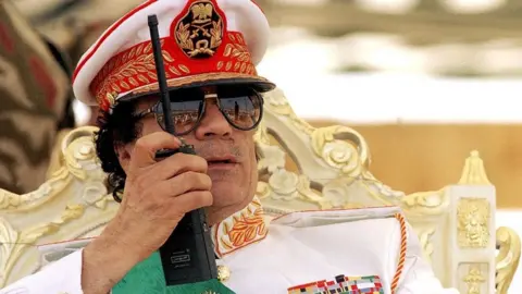 Getty Images 30th anniversary of the Revolution where Muammar Gaddafi assisting to the military parade in 1999