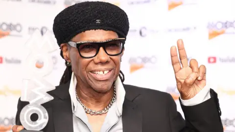 Nile Rodgers, Lifetime Achievement Award winner, poses with an award, during the 25th MOBO Awards in London in 2022. 