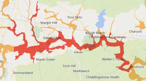 Environment Agency A map with red overlay showing areas in east Surrey and west Kent which are at risk of flooding.