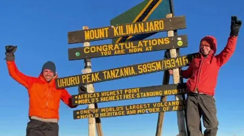 Sarah de Lagarde Sarah de Lagarde at the peak of Mount Kilimanjaro sign.