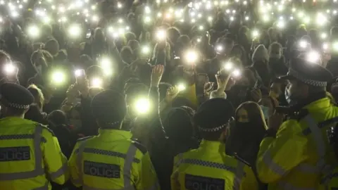 PA Media Police officers at the vigil for Sarah Everard in Clapham Common