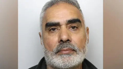 A police mugshot of Jagtar Sahota - a middle-aged man with short hair and a grey beard.