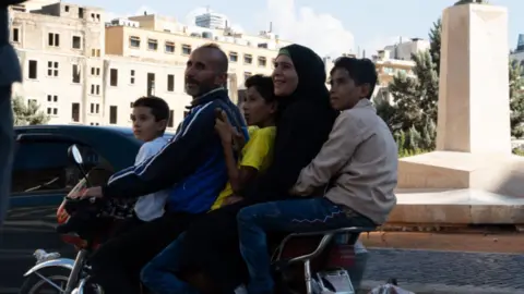 The family of five, Hassan Harfoush, arrived in Beirut by bicycle