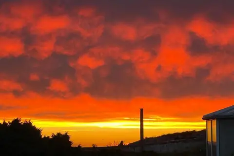 clare_hogan_photography/BBC Weather Watchers Red and yellow night sky from Burghead