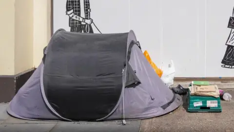 Reuters Tent on a pavement in an urban setting