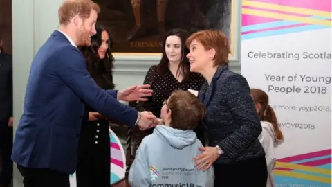 AFP/Getty Harry and Meghan meet Scotland's First Minister Nicola Sturgeon during a reception in the Palace of Holyroodhouse