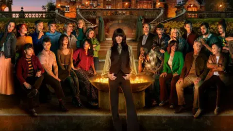 Claudia Winkleman pictured with this year's contestants on The Traitors.