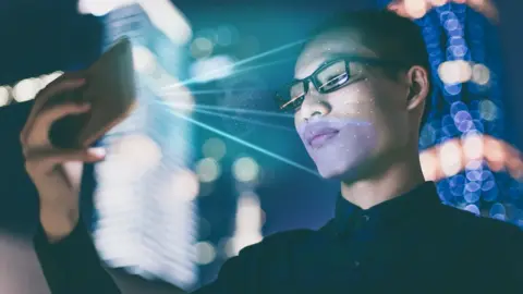 Person using facial recognition system on their smartphone