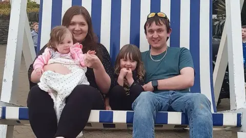 The Coastal Mummy Rebecca with husband Jonny and their children