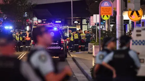 Getty Images Emergency services are seen at Bondi Junction after multiple people were stabbed inside the Westfield Bondi Junction shopping centre