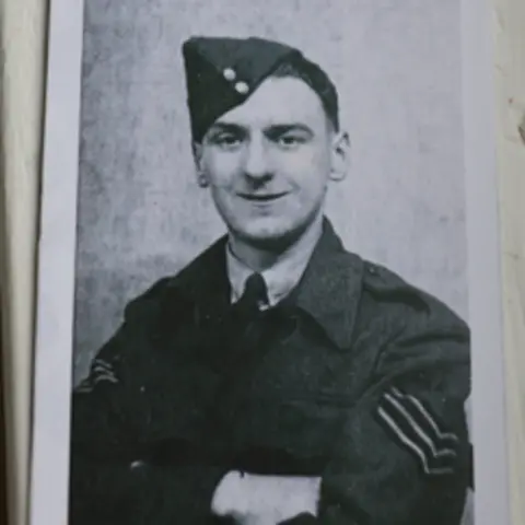 Bernard Morgan A photo of Bernard Morgan when he was a veteran in the Second World War. The photo is black and white and in it, Mr Morgan smiles at the camera while wearing his military uniform and cap.