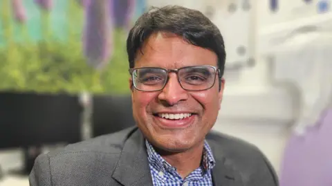 Consultant Dr Kailash Krishnan, sat in his office