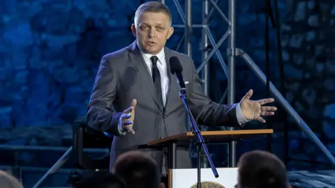 Shutterstock Slovak Prime Minister Robert Fico speaks during celebrations marking the 1161st anniversary of the arrival of Saints Cyril and Methodius in Great Moravia, at Devin Castle in Bratislava.