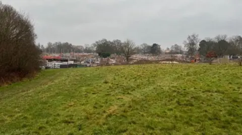 A photo within undeveloped golf course land where 70 new homes could be built, with a view towards the Emmer Green Drive development site off Kidmore End Road, Caversham