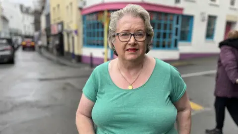 BBC Dania Lloyd outside shop