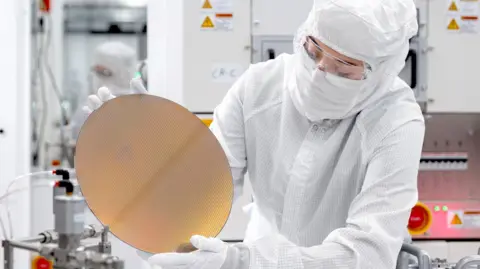 A worker at a Texas Instruments facility in the US.
