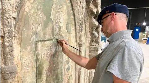 BBC A set designer at work