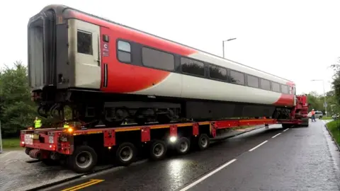 Julie Hockley Train carriage on transporter