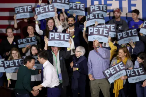 Getty Images Michael J Fox greets Buttigieg to the stage