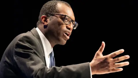 PA Media Chancellor of the Exchequer, Kwasi Kwarteng delivers his keynote speech to party members at the annual Conservative Party conference in Birmingham.