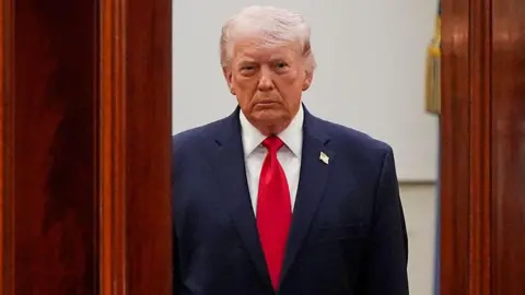 US President Donald Trump arrives for a prime-time address to the nation in the Cross Hall of the White House in Washington, DC, US, on Wednesday, 1 April, 2026.