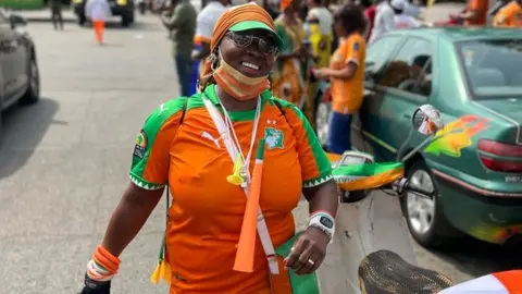 Ameer Ahmed/ BBC An Ivory Coast football fan