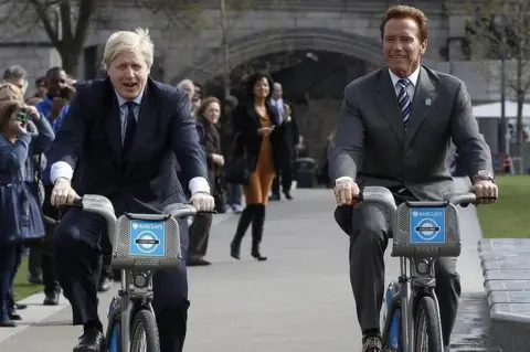 Reuters Boris Johnson and Arnold Schwarzenegger on bikes