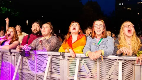 Getty Images People watch Manchester Pride perfromance